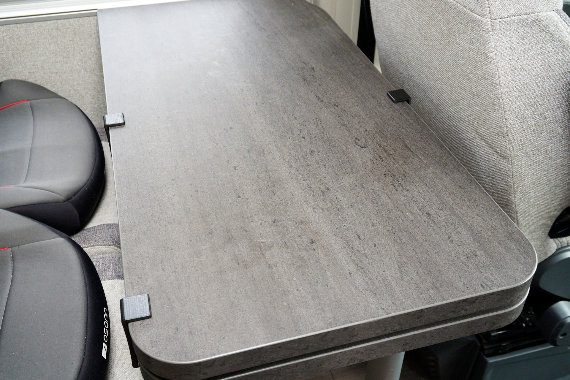 Table spacer for swivel tables in motorhomes